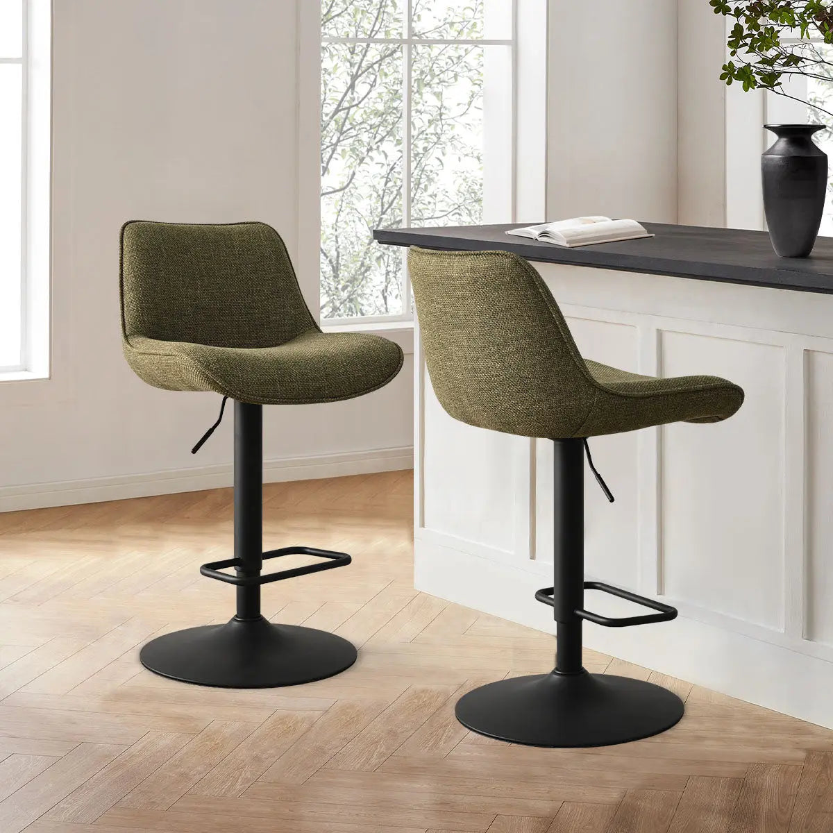 Hunter Modern Upholstered Swivel Adjustable Counter Stool in kitchen, light wood flooring, white panel walls.