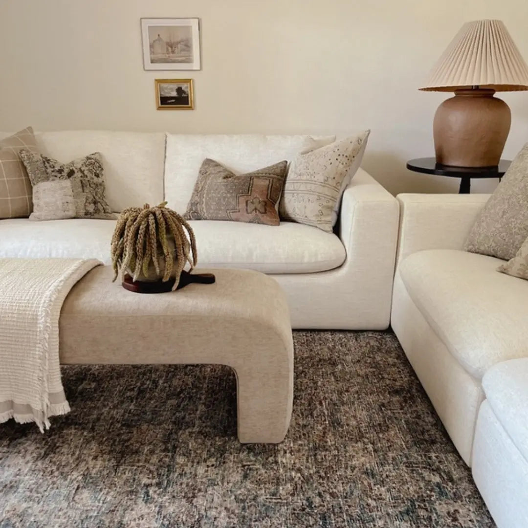 Lily Chenille Accent Waterfall Bench with neutral sofa, beige rug, in cozy living room.