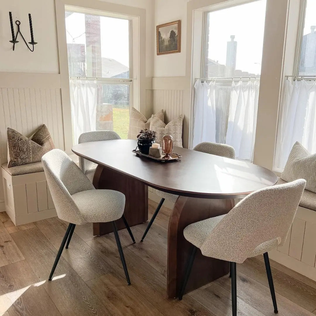 Edwin Modern Upholstered Dining Chair in cozy dining room with wooden floor, beige walls.