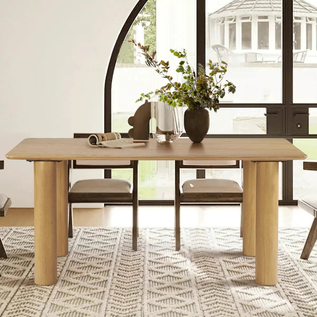 Johson Modern Solid Oak Rectangle Dining Table with chairs, patterned rug, and arched windows.