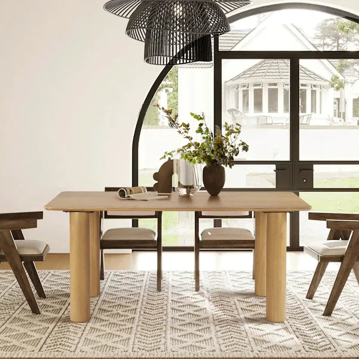 Johson Modern Solid Oak Dining Table in cozy dining room with geometric rug and stylish chairs.