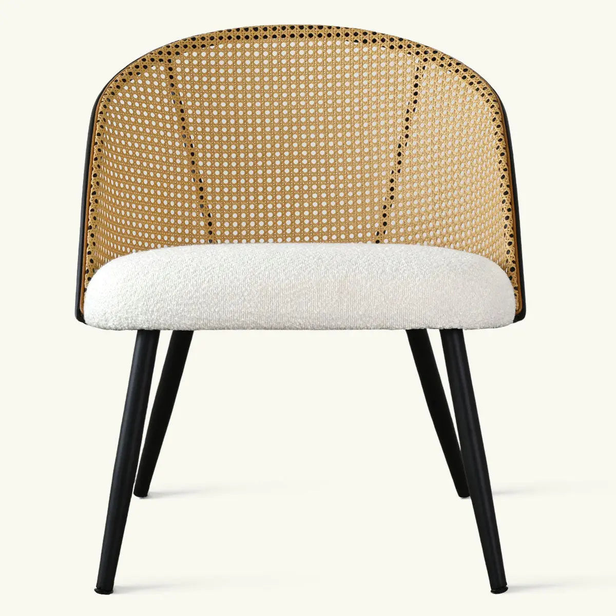 Jules Modern Upholstered Rattan Dining Chair with black legs, wicker back, white cushion.