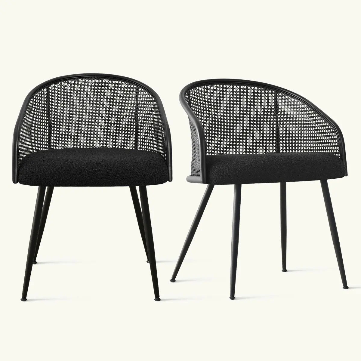 Jules Modern Upholstered Rattan Dining Chair with Arms in sleek black, minimalist design, solid backdrop.