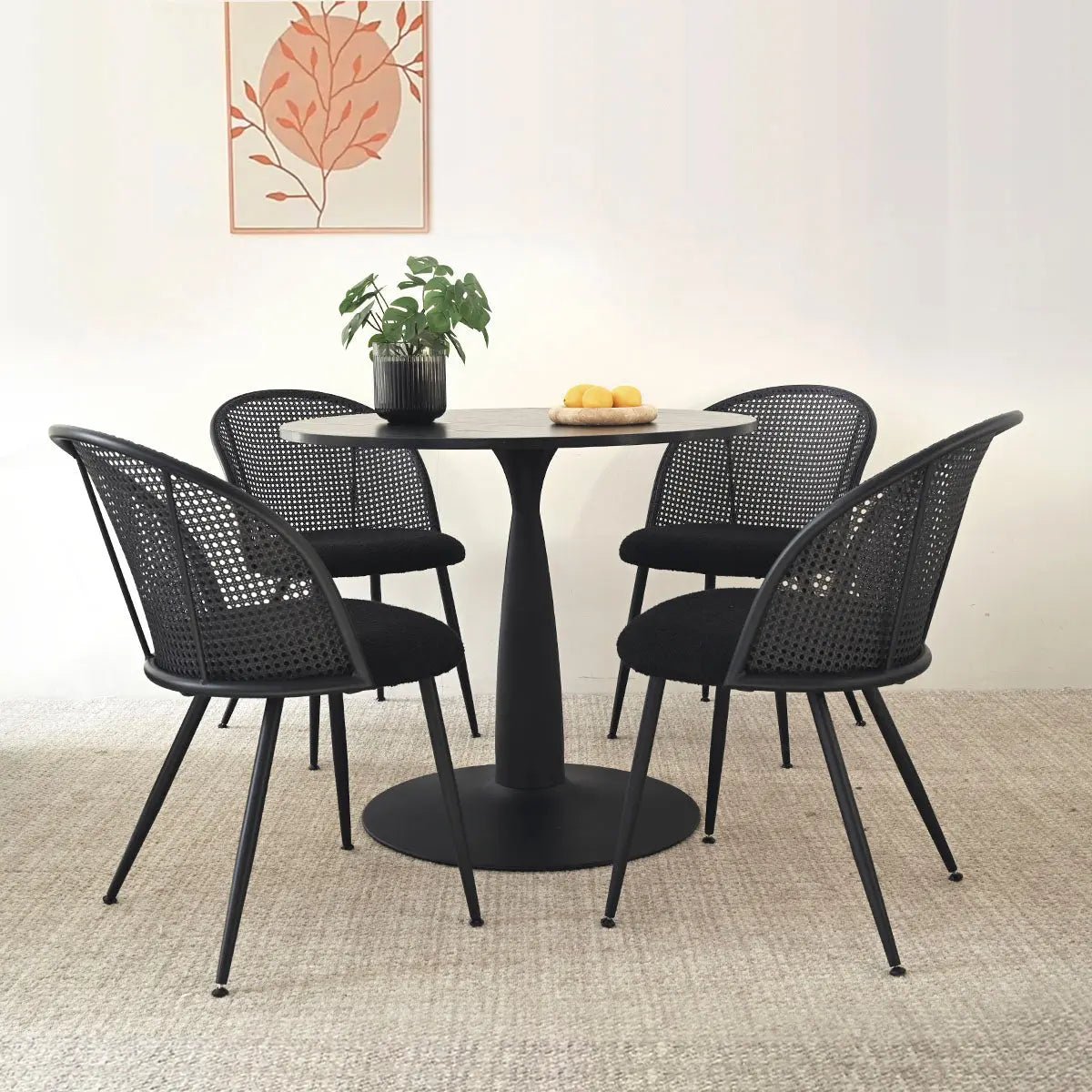 Haven & Jules dining set, black round table, four chairs, beige carpet, wall art accent.