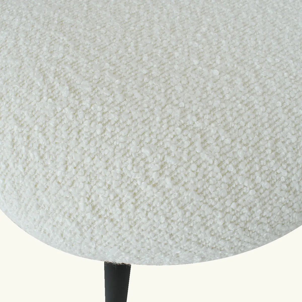 Close-up of white upholstery fabric texture on Jules Modern Upholstered Rattan Dining Chair seat.