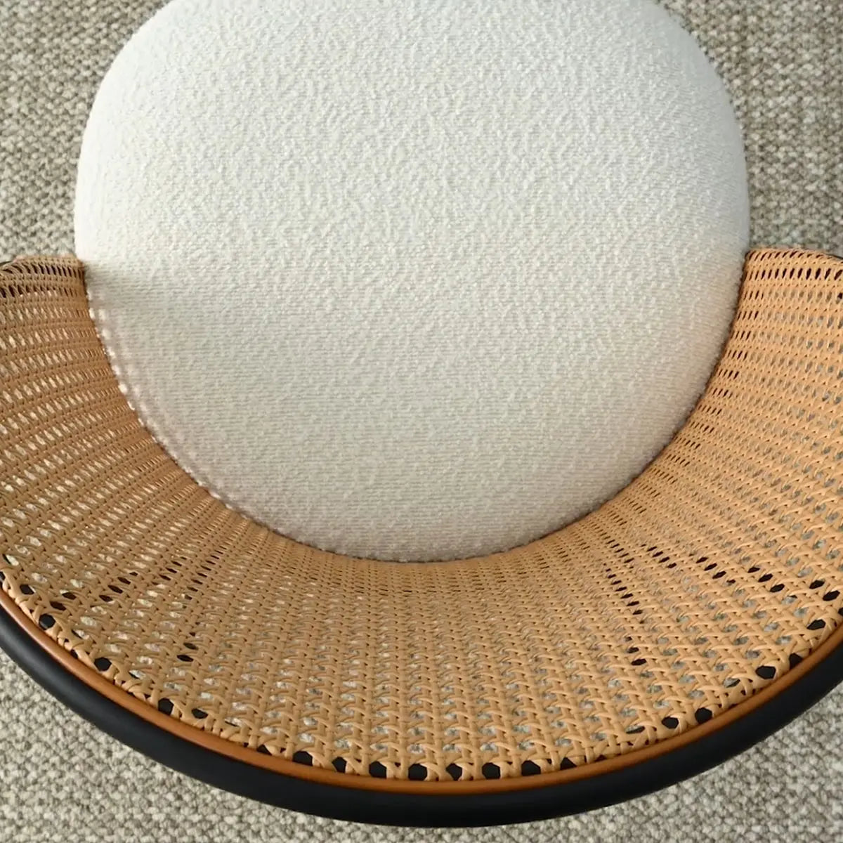 Overhead view of Jules Modern Upholstered Rattan Dining Chair with textured white cushion on carpet.