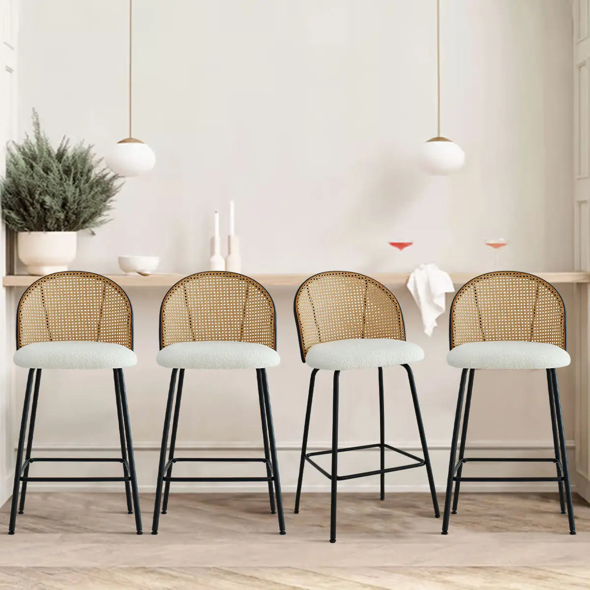 Jules Modern Upholstered Rattan Counter Stool Set in cozy dining space, light walls, wood flooring.