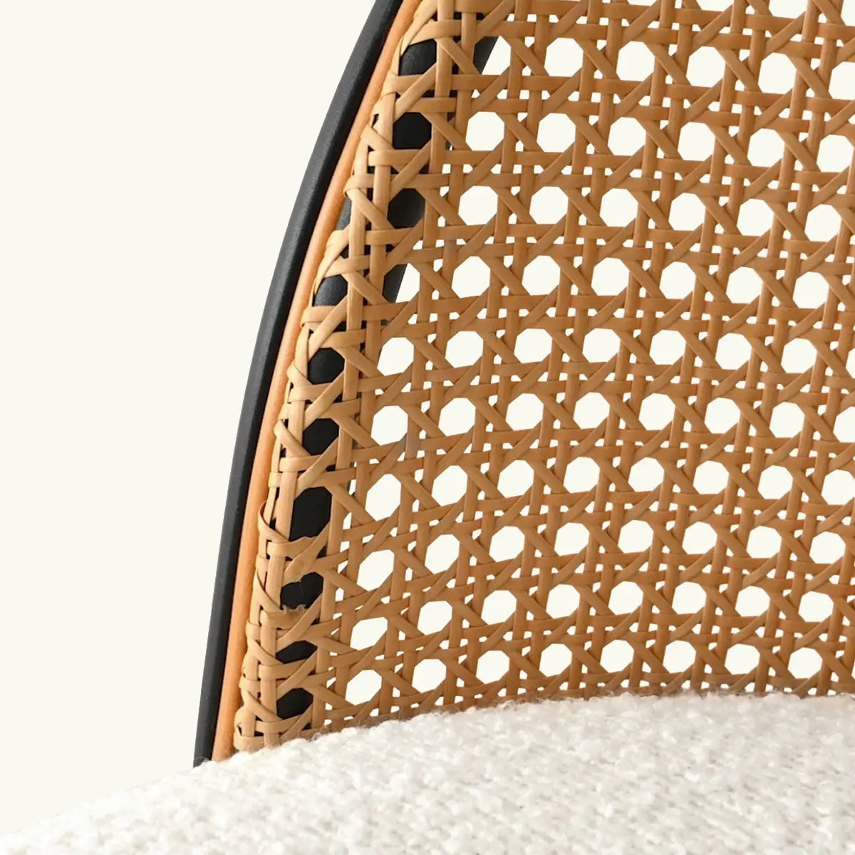 Close-up of Jules Modern Upholstered Rattan Counter Stool detailing woven design and textile seat.