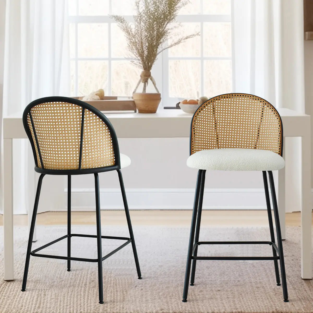 Jules modern rattan counter stools in dining room with light wood flooring and white walls.