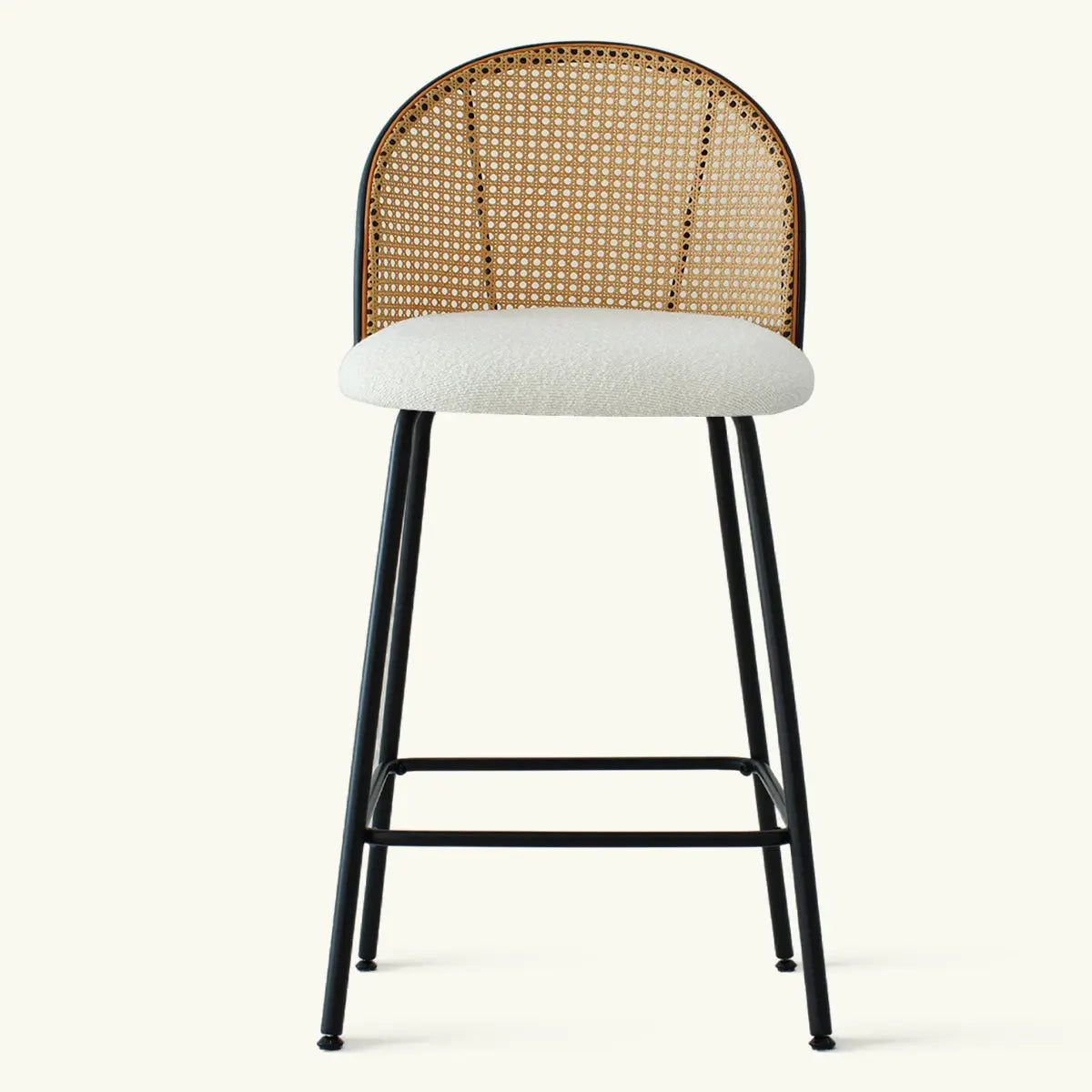 Jules Modern Upholstered Rattan Counter Stool with white cushion, black legs, no background details.