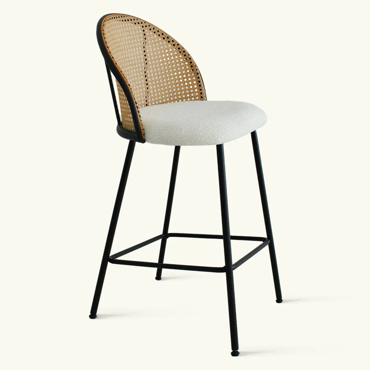 Jules Modern Upholstered Rattan Counter Stool with black metal legs on neutral background.