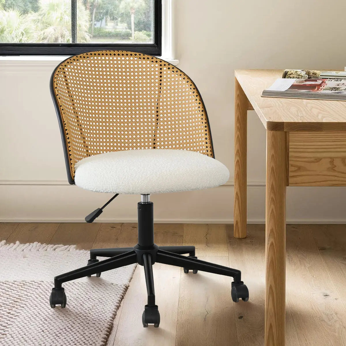 Jules Modern upholstered rattan office chair with wooden desk, beige walls, and light wood flooring.