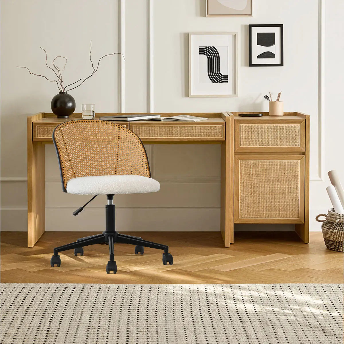 Jules Modern Upholstered Rattan Chair in office, wooden desk, light walls, parquet floor, decor frames.