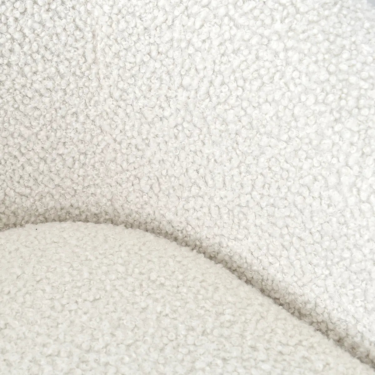 Close-up texture of Kiki Modern Boucle Accent Chair upholstery in soft white fabric.