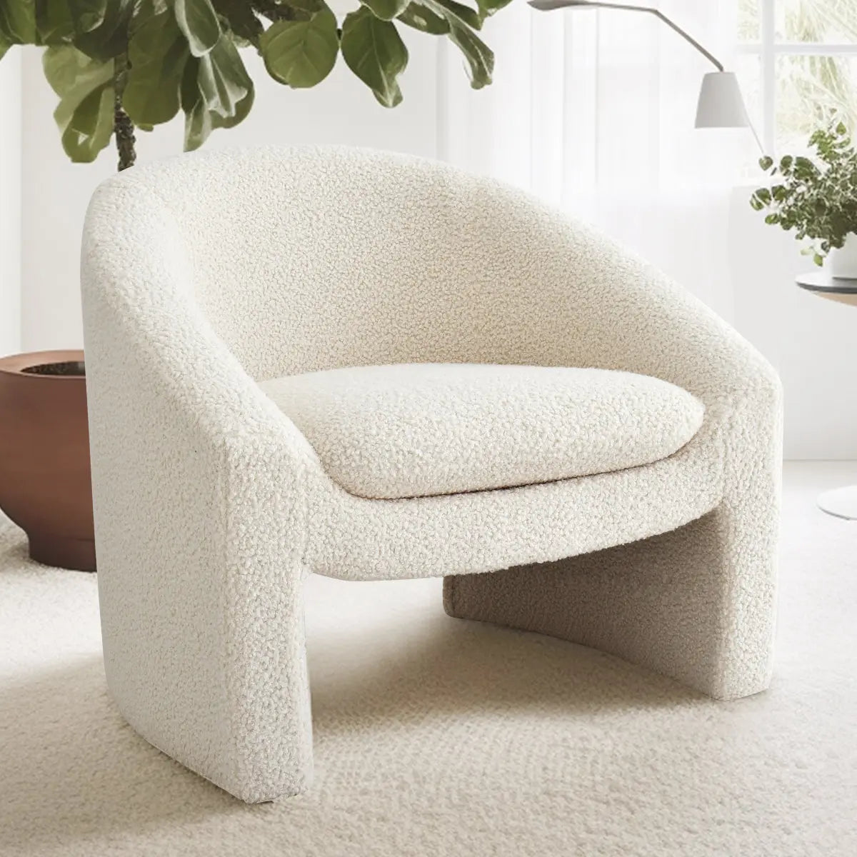 Kiki Modern Boucle Accent Chair with Arms in bright room featuring white walls and carpet.