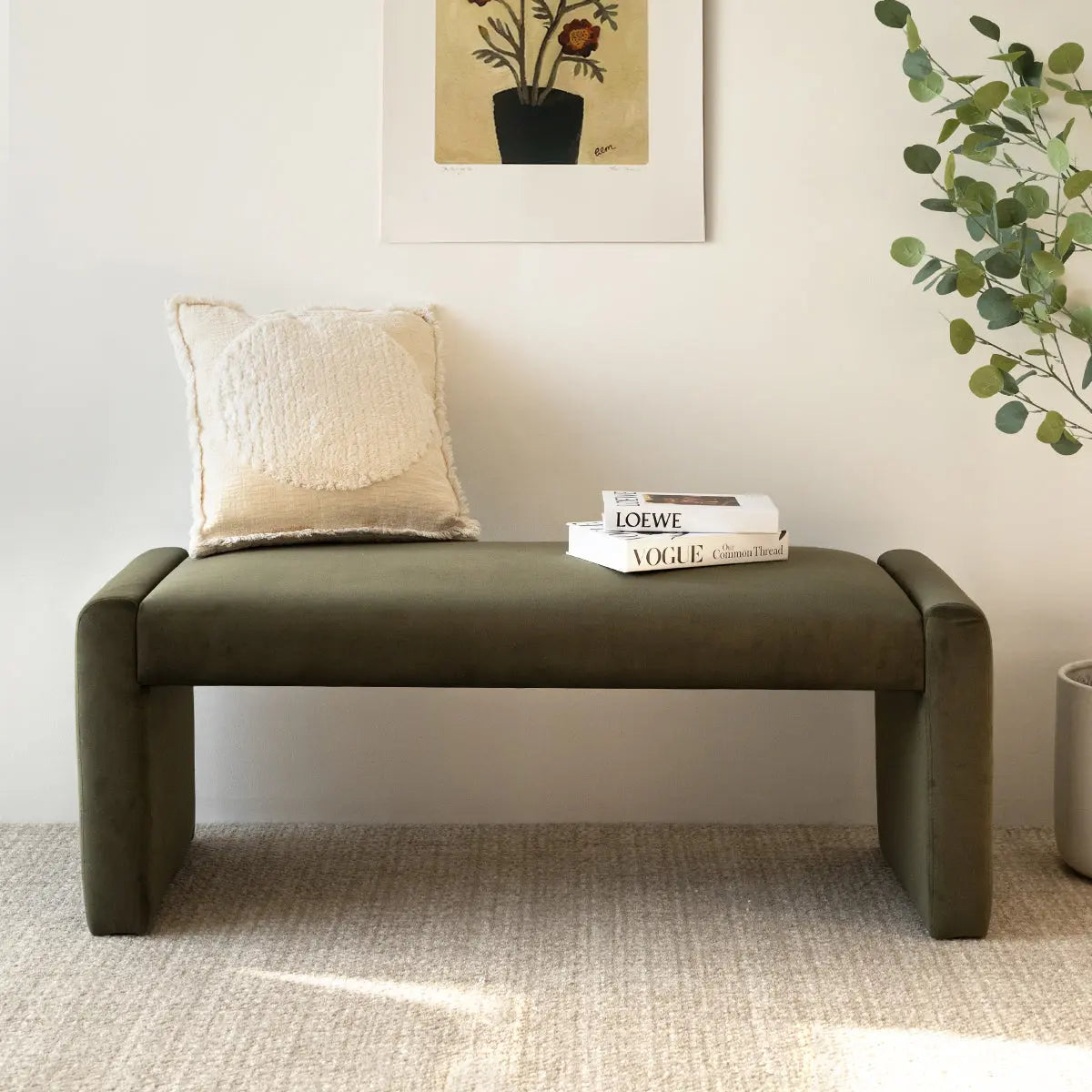 Kaia Faux Leather & Velvet Waterfall Bench, beige cushion, carpeted floor, neutral wall decor.