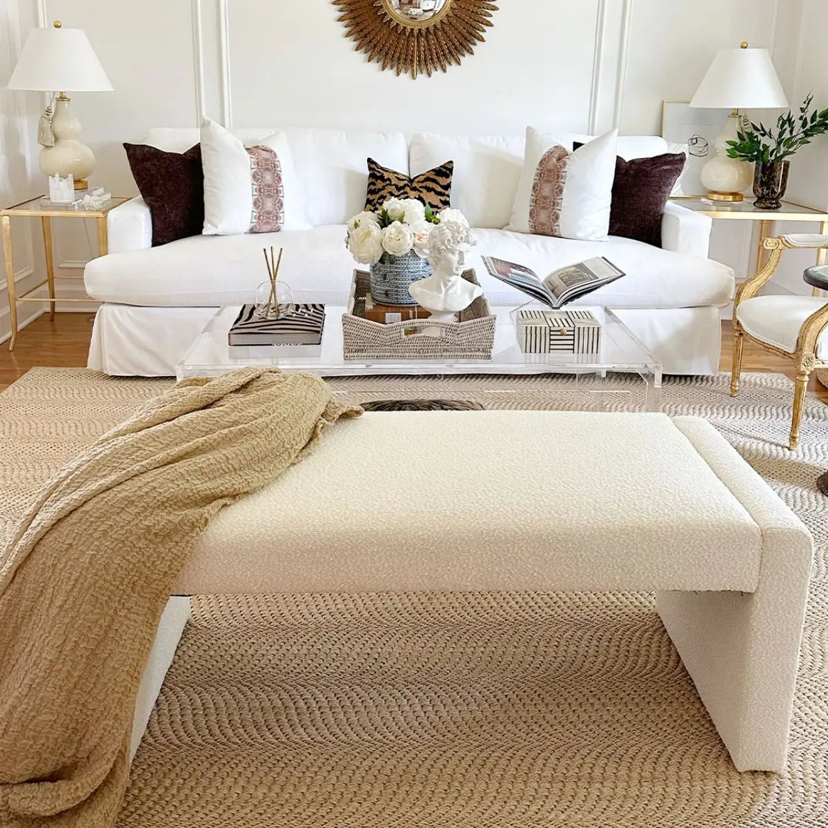 Kaia Modern Beige Waterfall Bench in elegant living room with white sofa, gold accents, and rug.