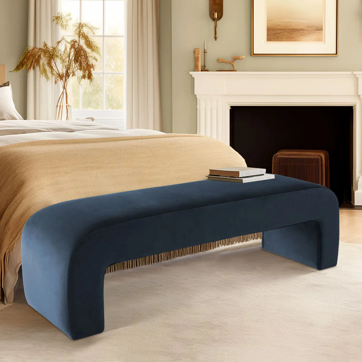 Blue velvet bench by Lily in cozy bedroom, beige walls, modern fireplace, soft carpet flooring.