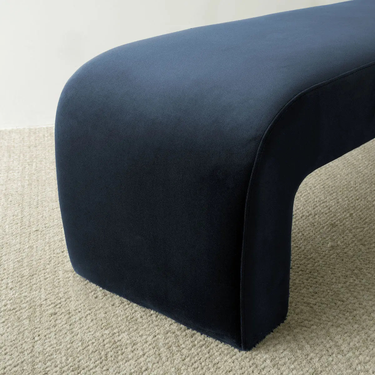 Lily Modern Velvet Accent Waterfall Bench on beige carpet, in neutral room setting.