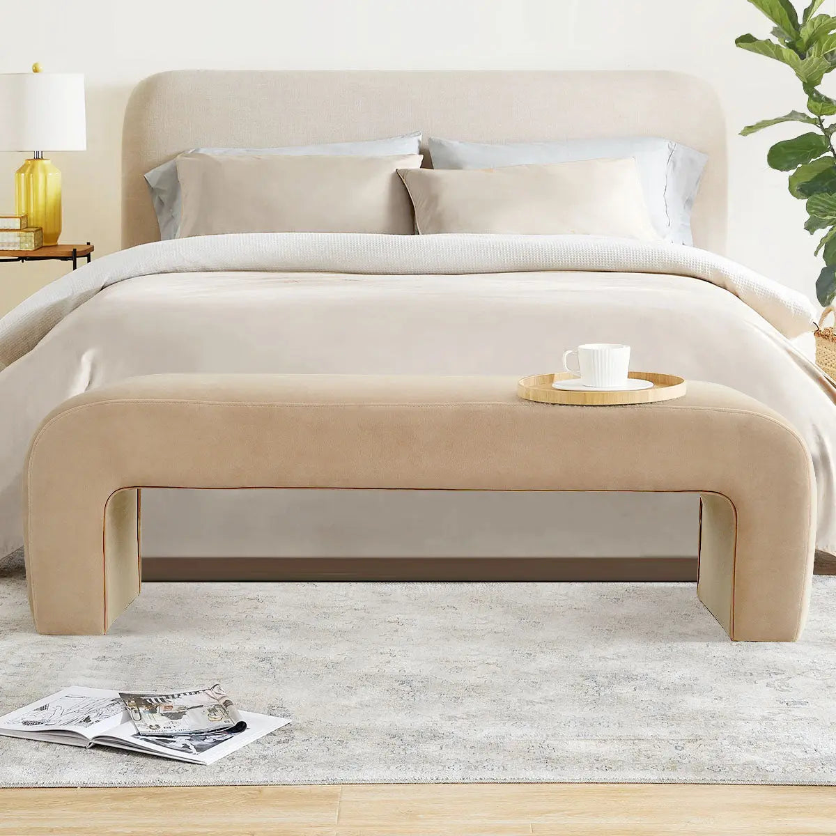 Lily Modern Velvet Accent Waterfall Bench in bedroom with beige bed, soft rug, light wood flooring.