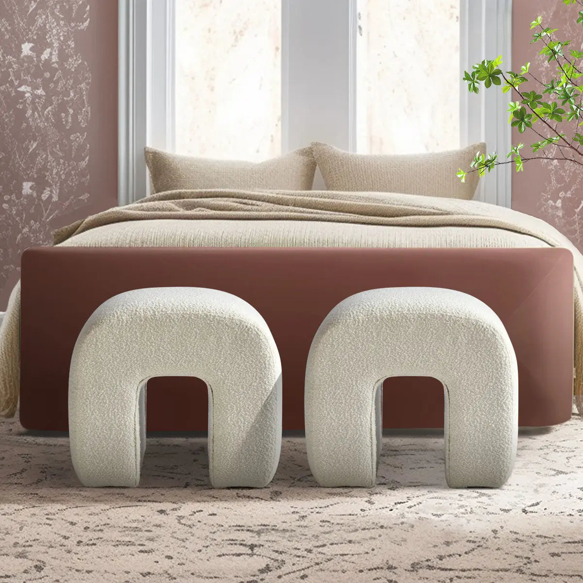 Lily Beige Boucle Upholstered Waterfall Ottoman in elegant bedroom, patterned carpet, decorative wallpaper.