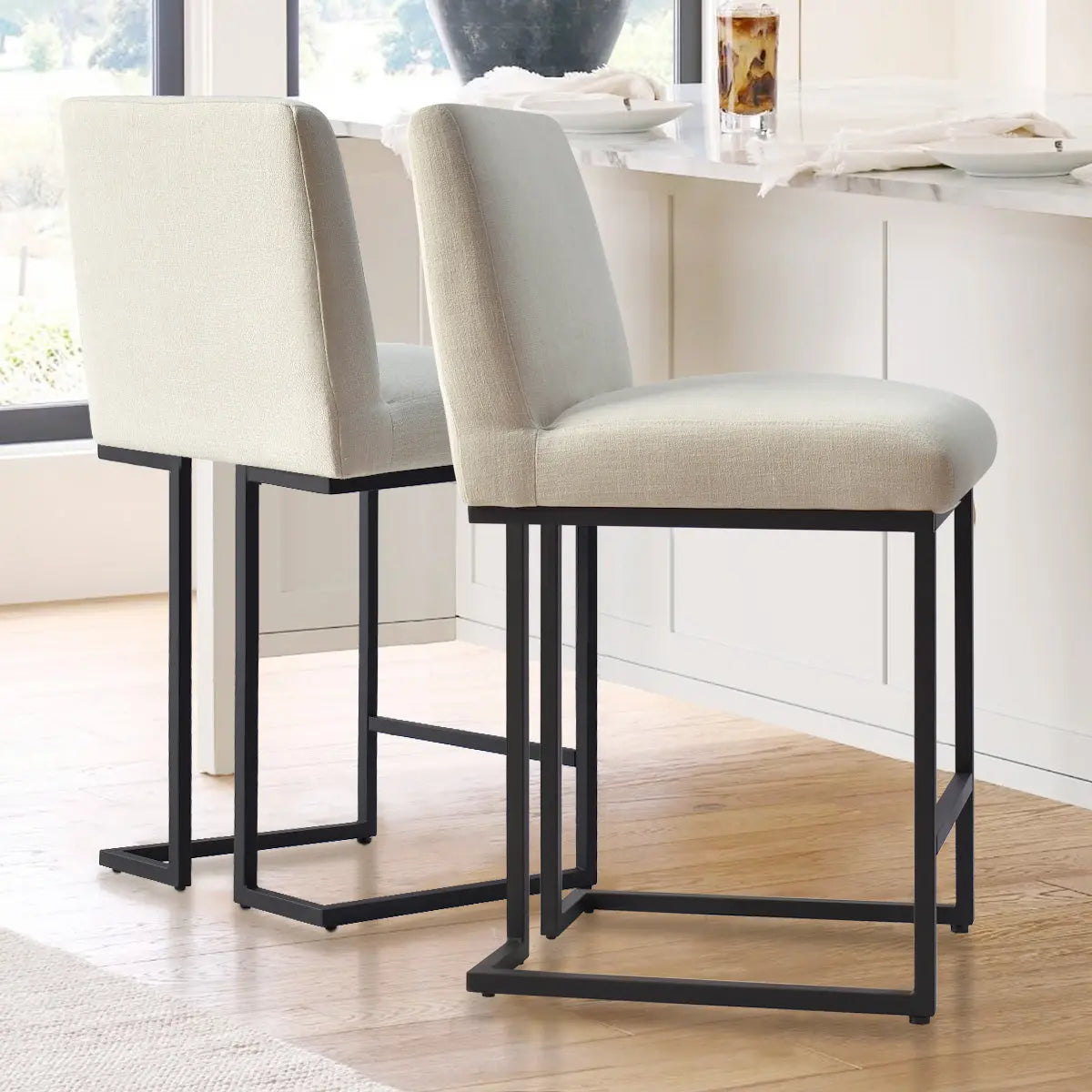 Mason Modern Metal Frame Upholstered Counter Stool in white kitchen with light wood flooring.