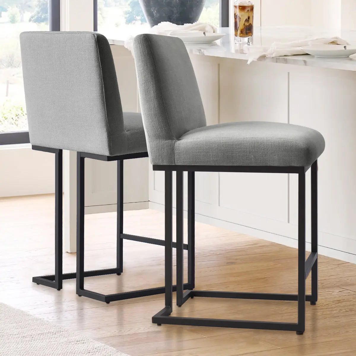 Mason Modern Metal Frame Upholstered Counter Stool in dining room with wood flooring and neutral decor.