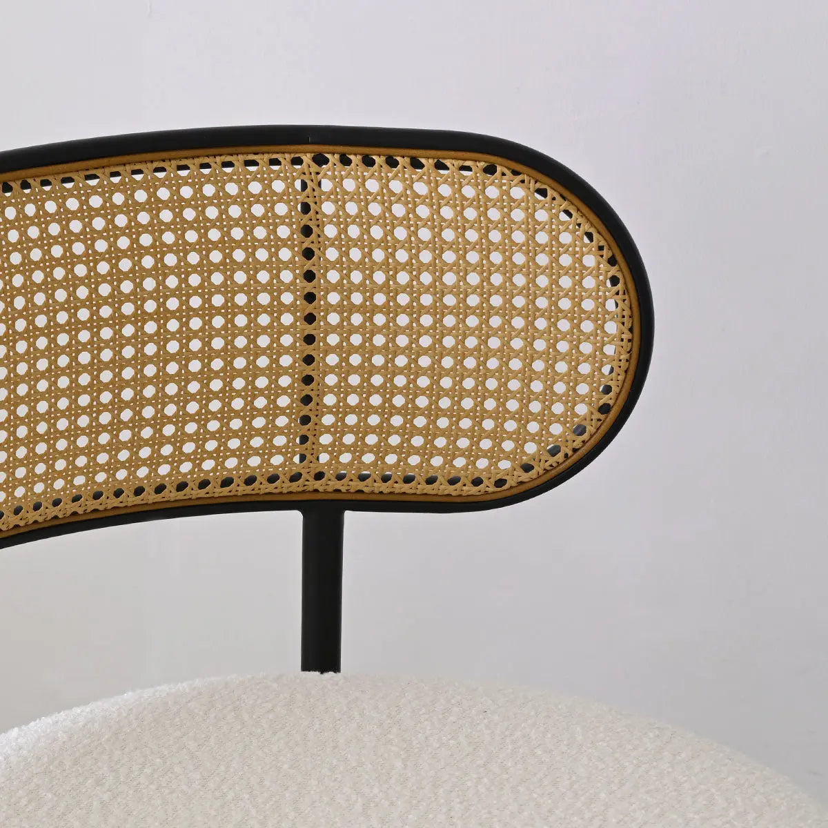 Marse Boucle barrel chair with rattan back detail, ivory upholstery, modern style.