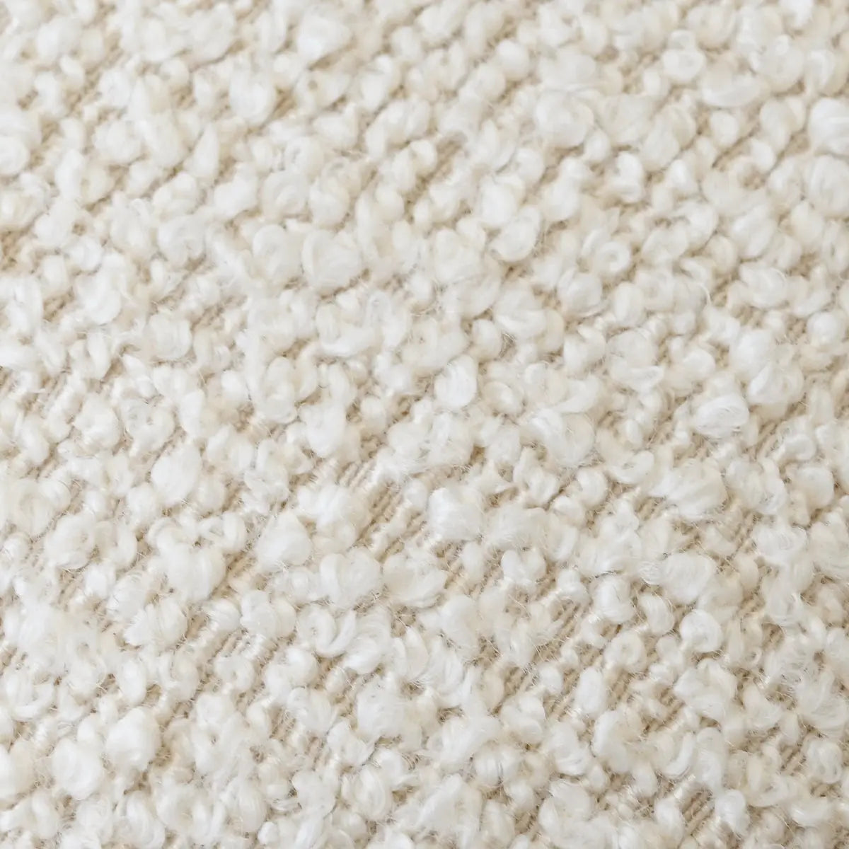 Close-up texture of Maye Boucle Beige Upholstered Dining Chair fabric, highlighting cozy boucle material.