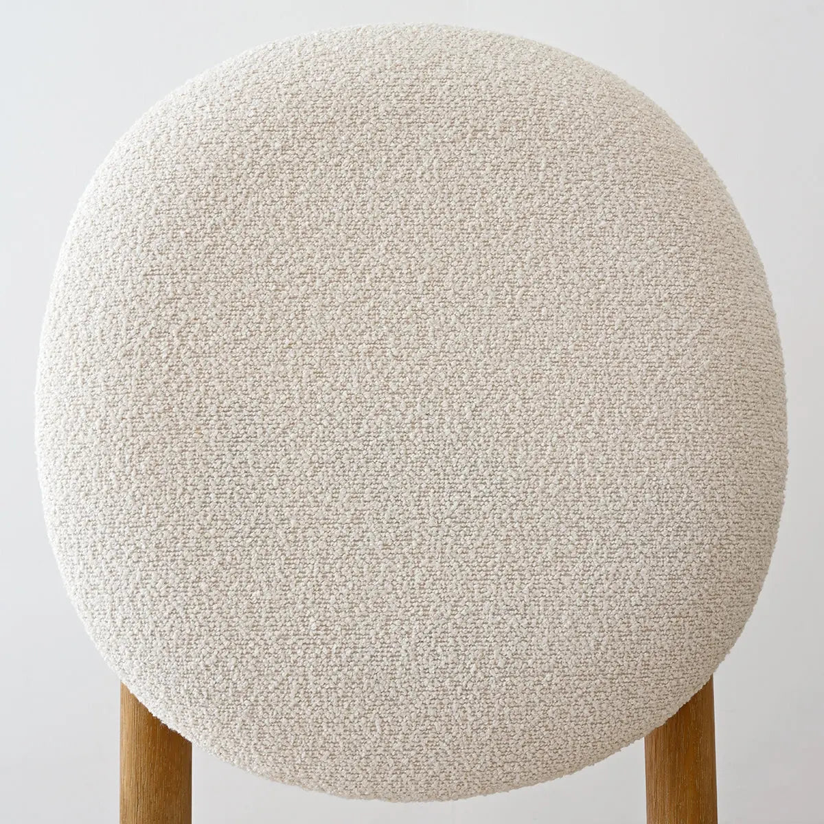 Maye Boucle Beige Dining Chair detail, textured upholstery, wooden legs. Elegant design, neutral tones.