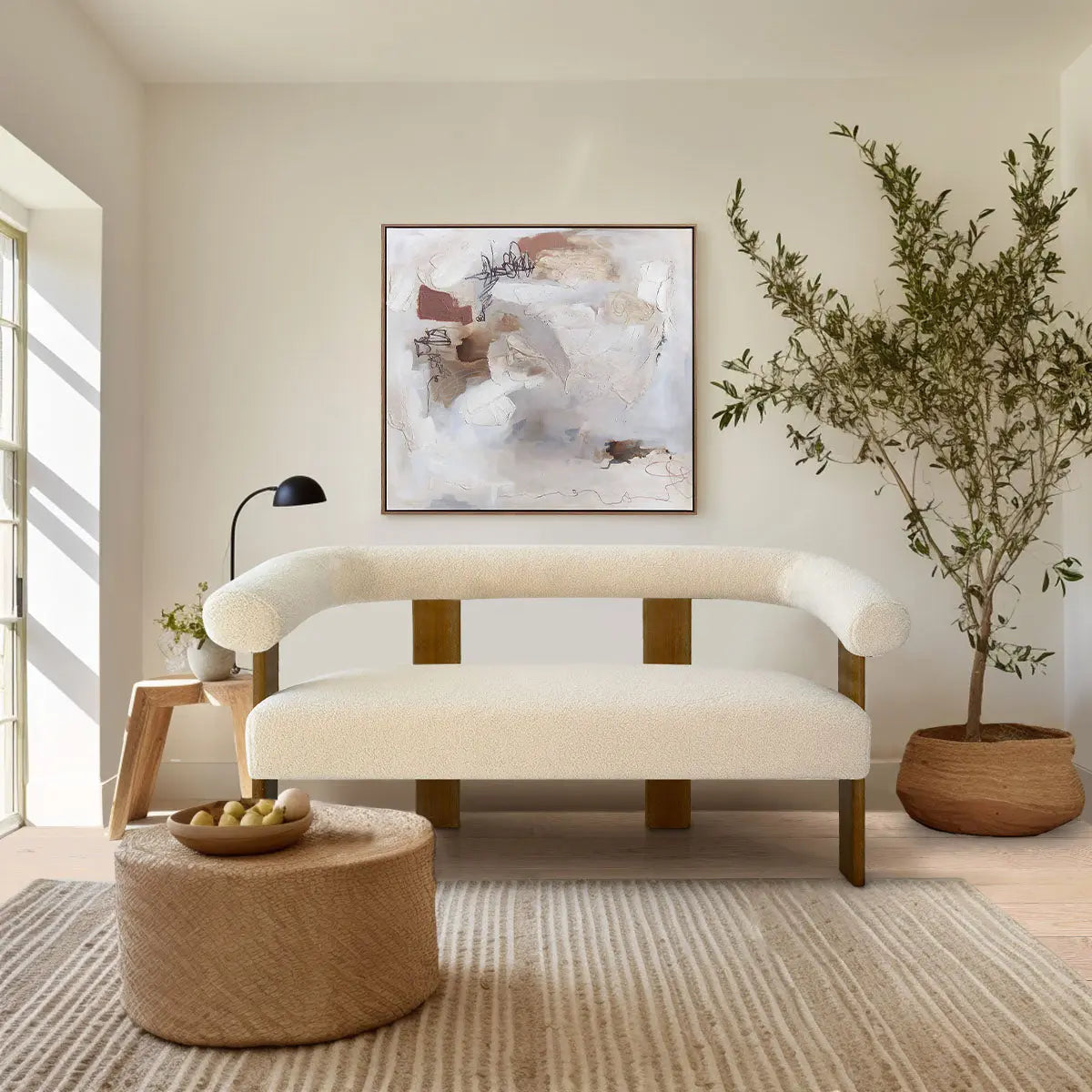 Maye Modern Beige Upholstered Loveseat Sofa in living room, light wood floors, abstract wall art.