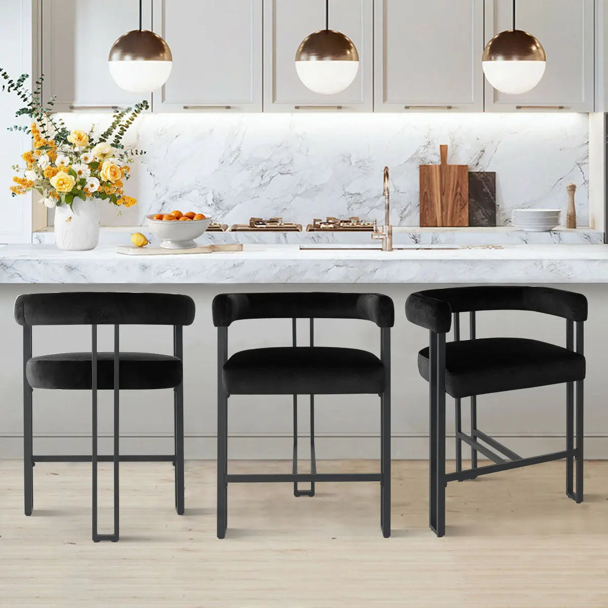 Mia Modern Velvet Accent Counter Stool in kitchen with marble counter, pendant lights, and wood flooring.