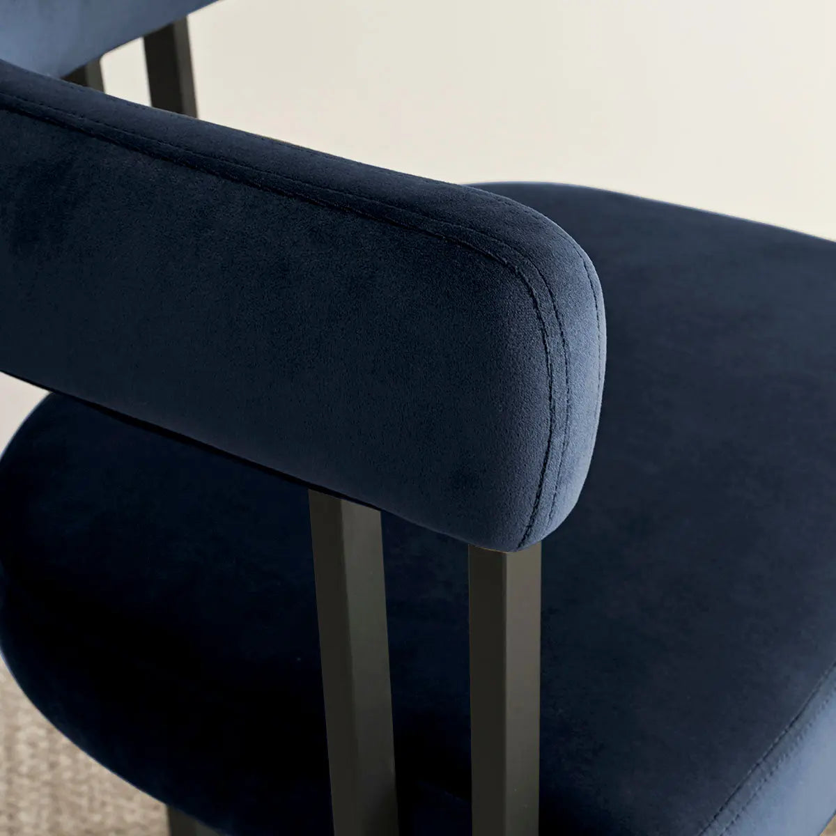 Elegant navy Mia Velvet Accent Dining Chair in dining room with light walls, modern style.