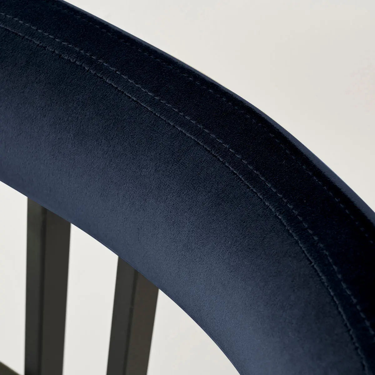 Close-up of deep blue Mia Velvet Accent Dining Chair back, showcasing premium fabric texture.