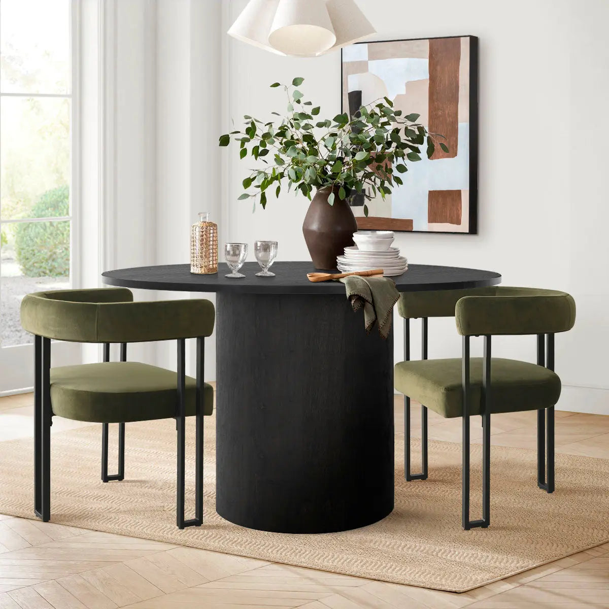 Olive Mia Velvet Accent Dining Chair with black dining table, beige rug, and abstract wall art.