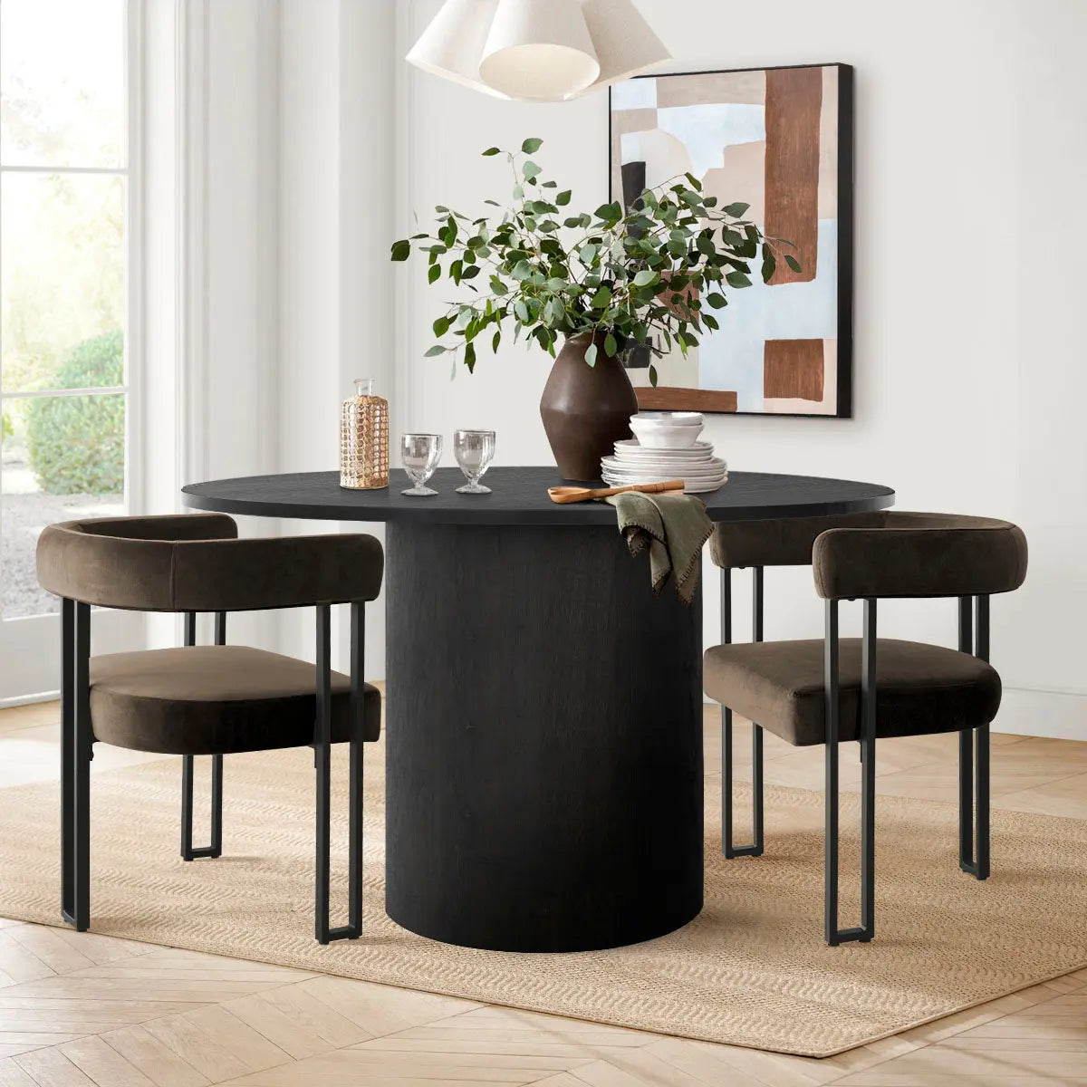 Mia Velvet Accent Dining Chair with black table, modern art, neutral walls, wooden flooring.