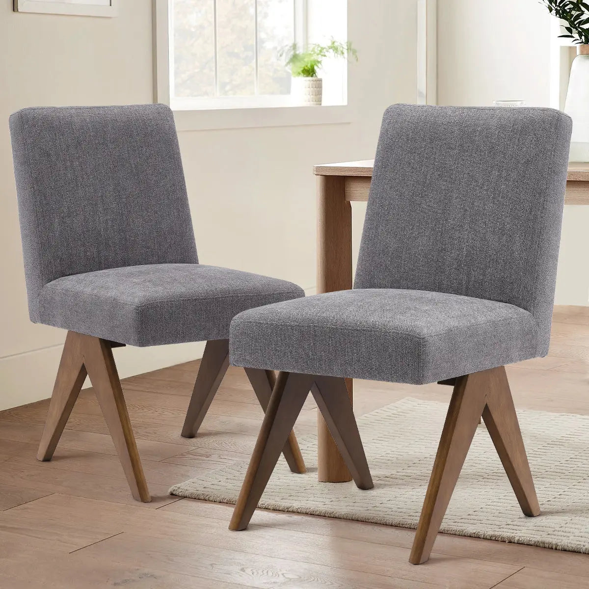 Morgan Mid Century Modern Upholstered Dining Chair with wooden legs in bright dining room setting.