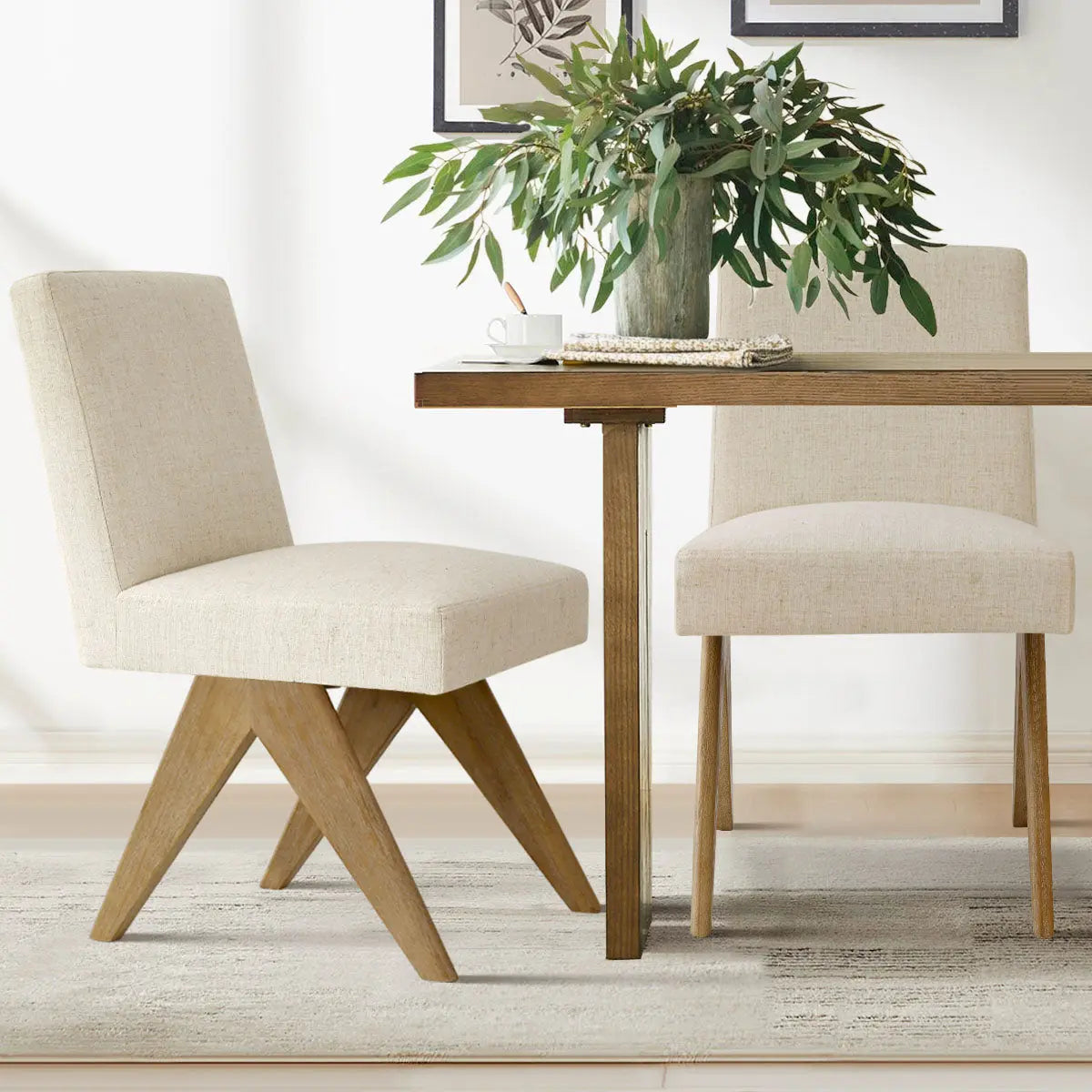 Morgan Mid-Century Boucle Dining Chairs with wooden table, beige rug, and framed wall art.