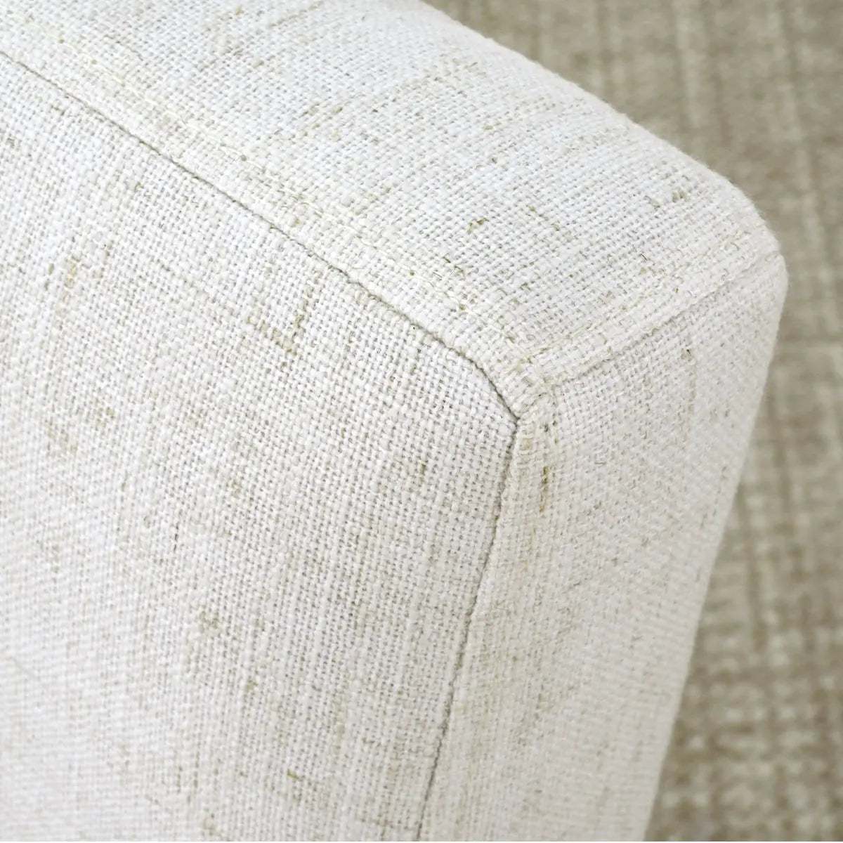 Close-up of Morgan Mid-Century Boucle Upholstered Dining Chair fabric texture, showing unique woven pattern.