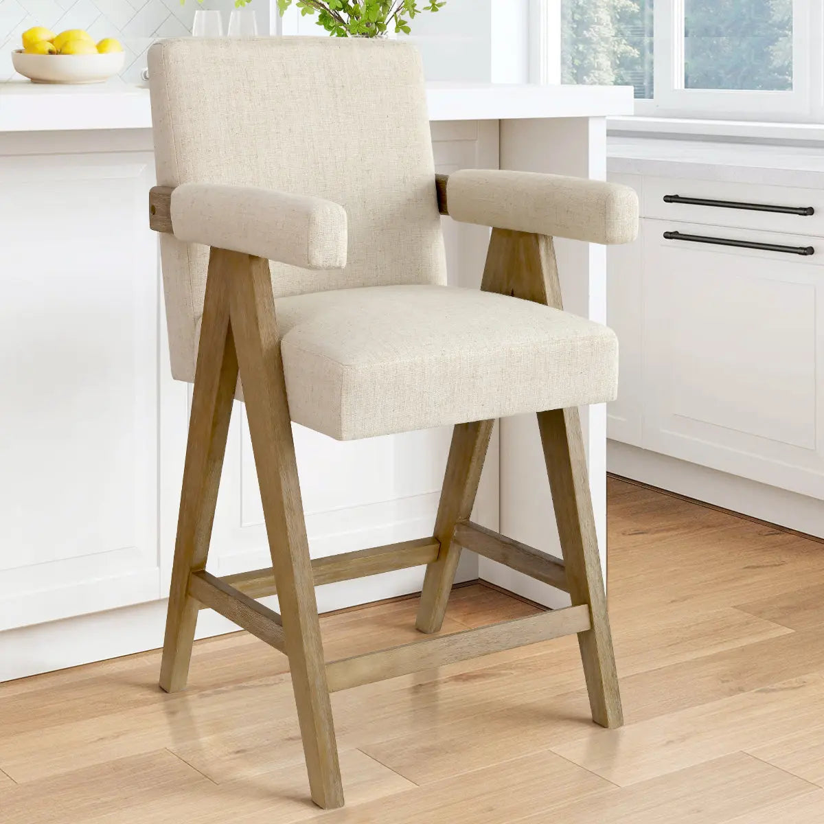 Morgan Mid Century Upholstered Counter Stool in kitchen, light wood flooring, white cabinetry, bright room.