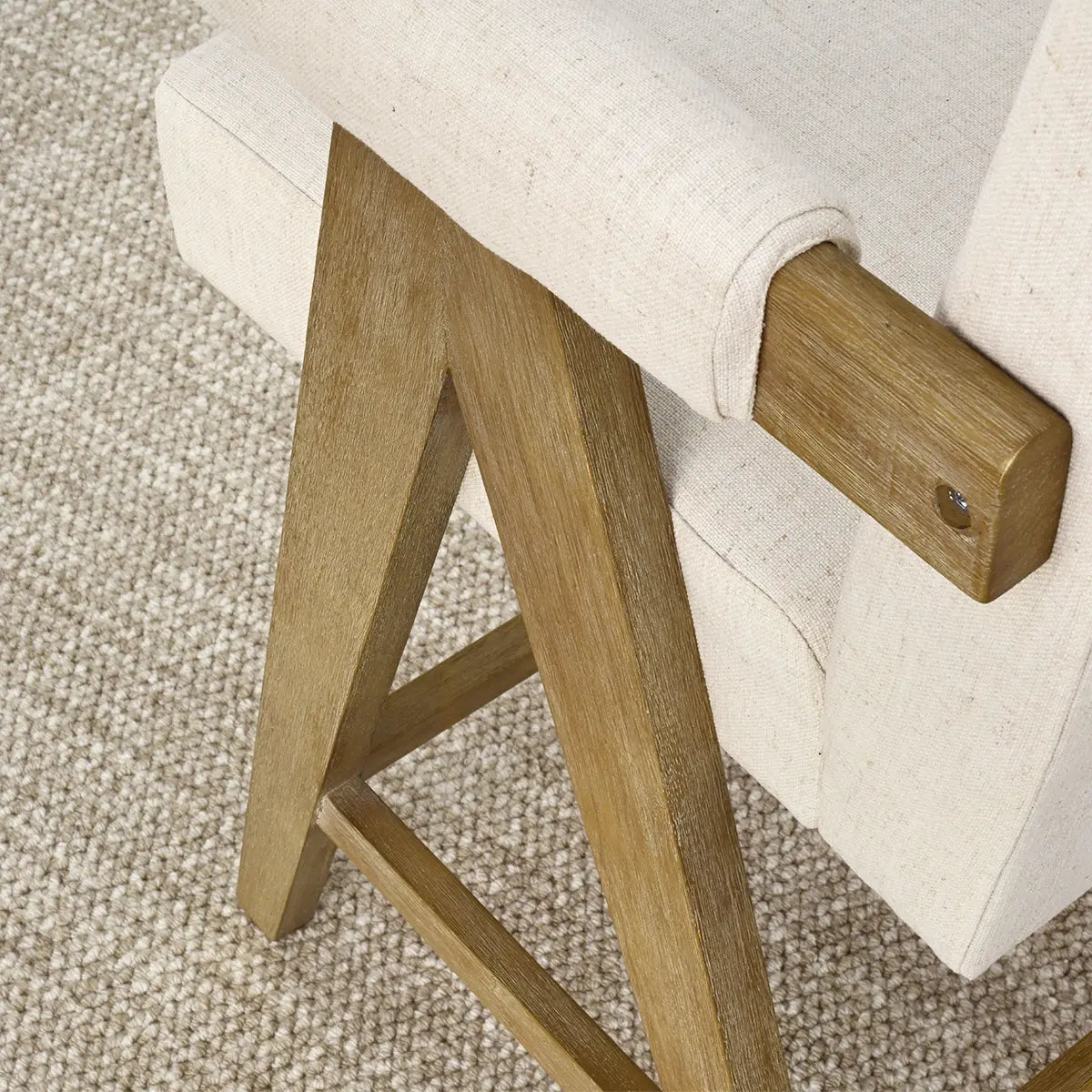 Morgan Mid Century Modern Upholstered Counter Stool detail, beige fabric, wood frame, textured carpet.