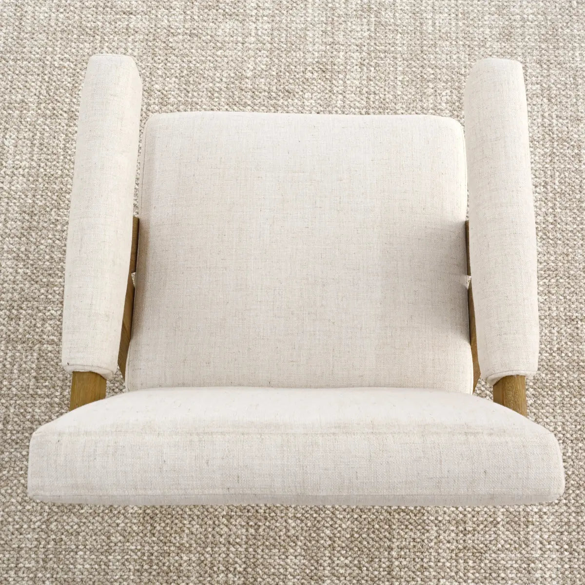 Morgan Mid Century Upholstered Counter Stool, beige fabric, light wood arms, against textured carpet.