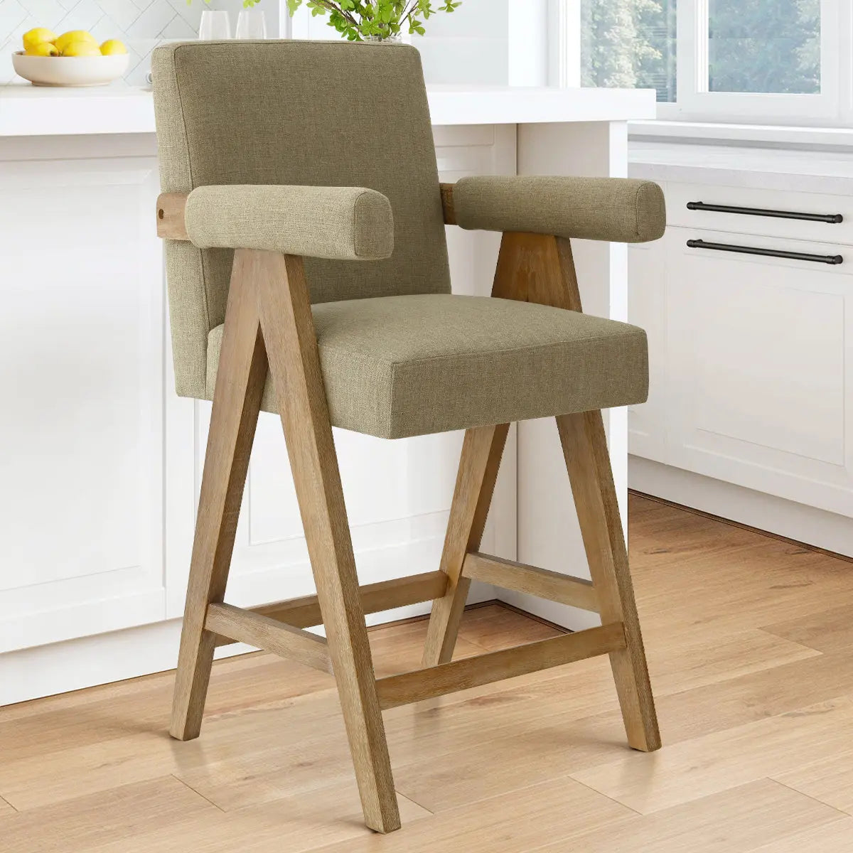 Morgan Mid Century Modern Upholstered Counter Stool with Arms in kitchen, white cabinetry, hardwood flooring.