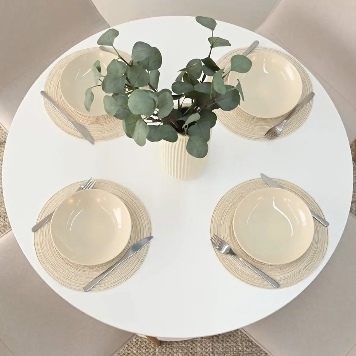 Haven & Oslo dining table set with beige chairs, white tabletop in a cozy dining room.