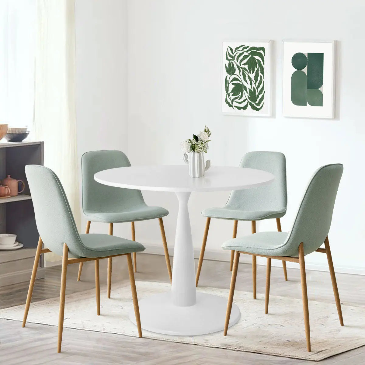 Haven & Oslo dining table set with mint green chairs in minimalistic room, light wood flooring.