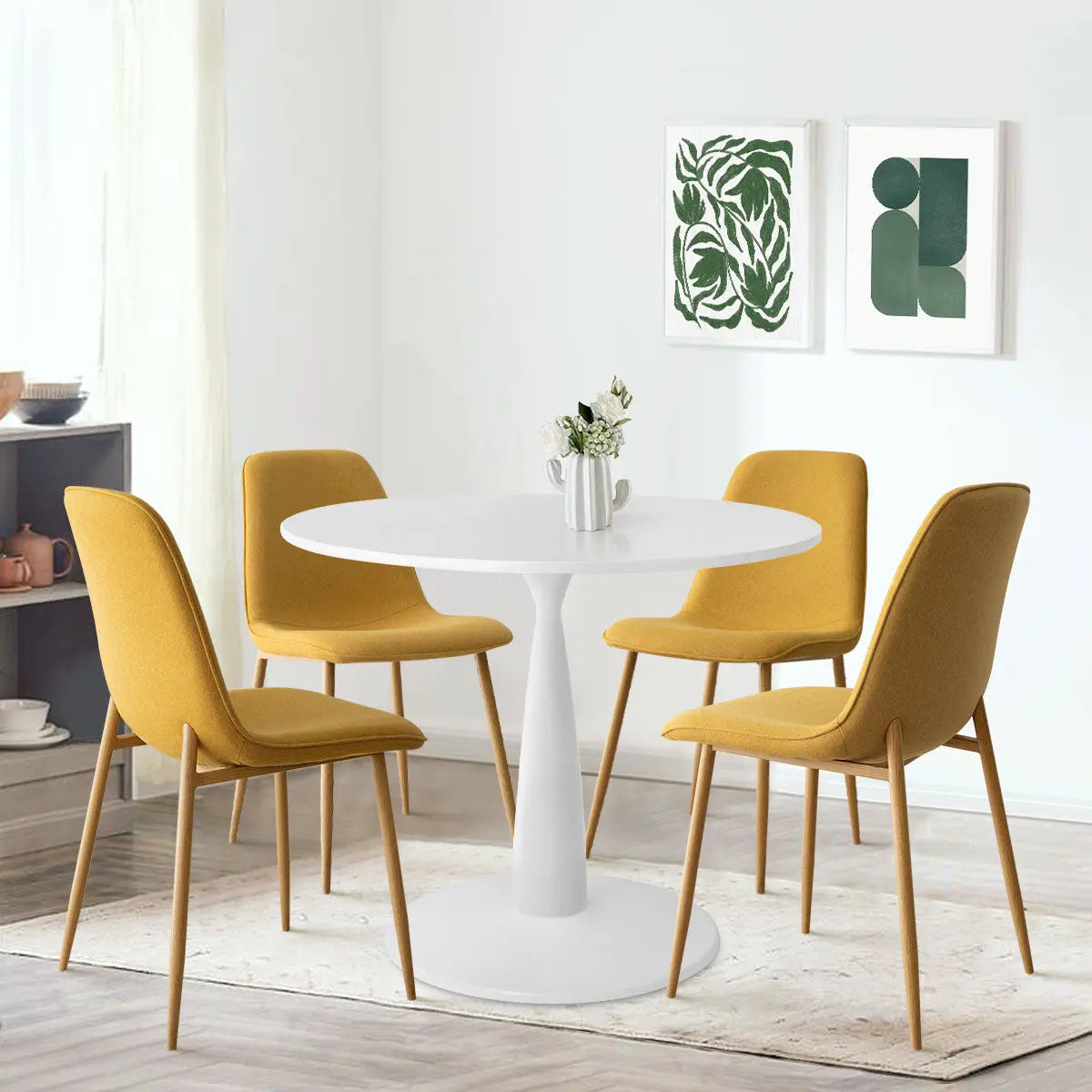 Haven & Oslo White Round Dining Table Set with mustard chairs, light wood flooring, modern decor.