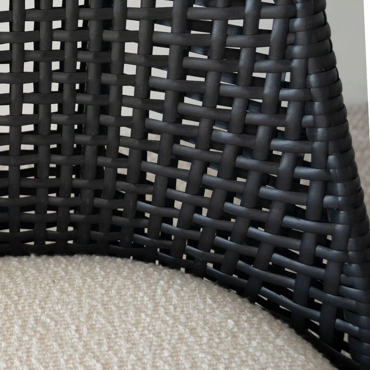 Close-up of Nice Rattan Upholstered Dining Chair wicker pattern and upholstery detail.