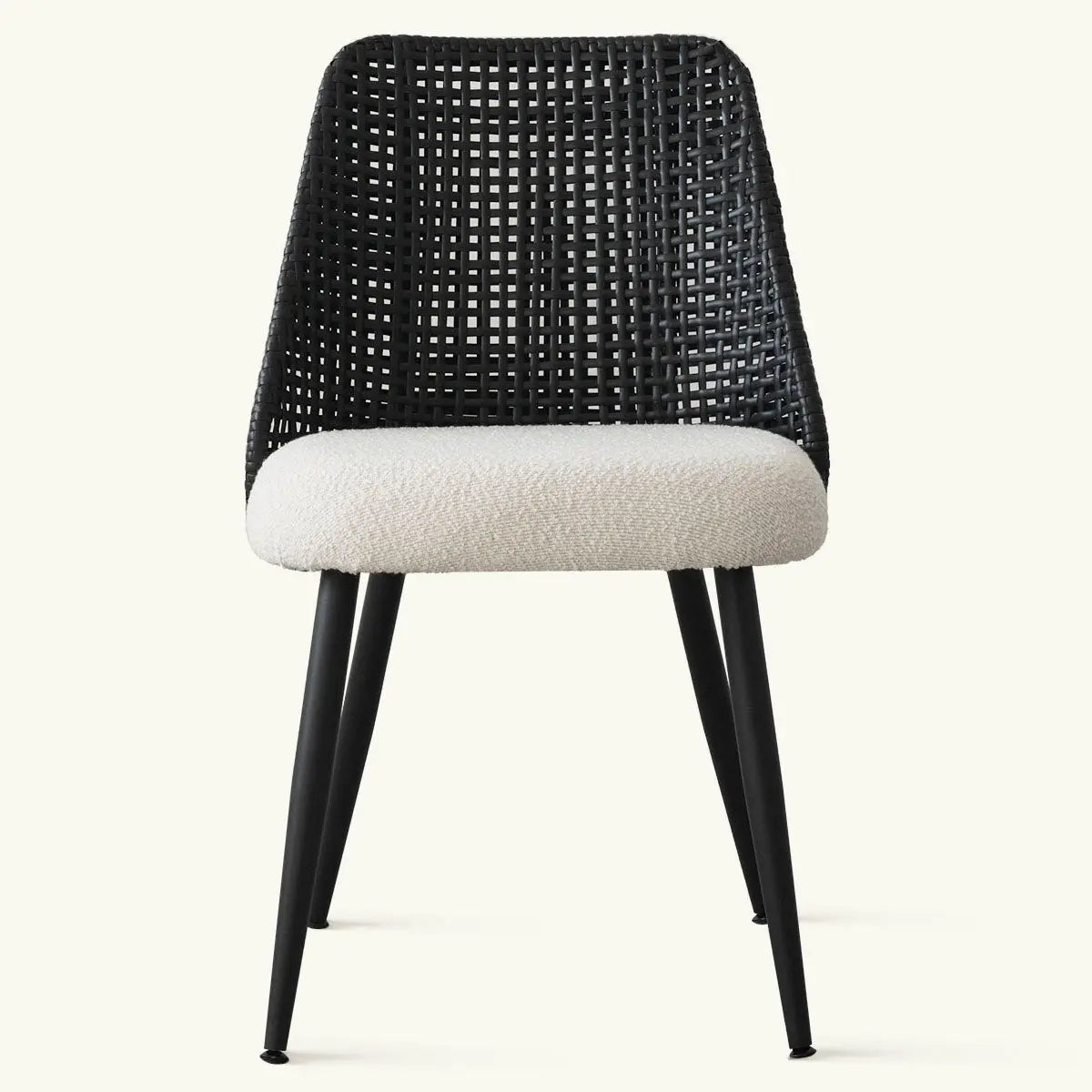 Nice Rattan Upholstered Dining Chair with black woven backrest and cushioned seat, stylish design.