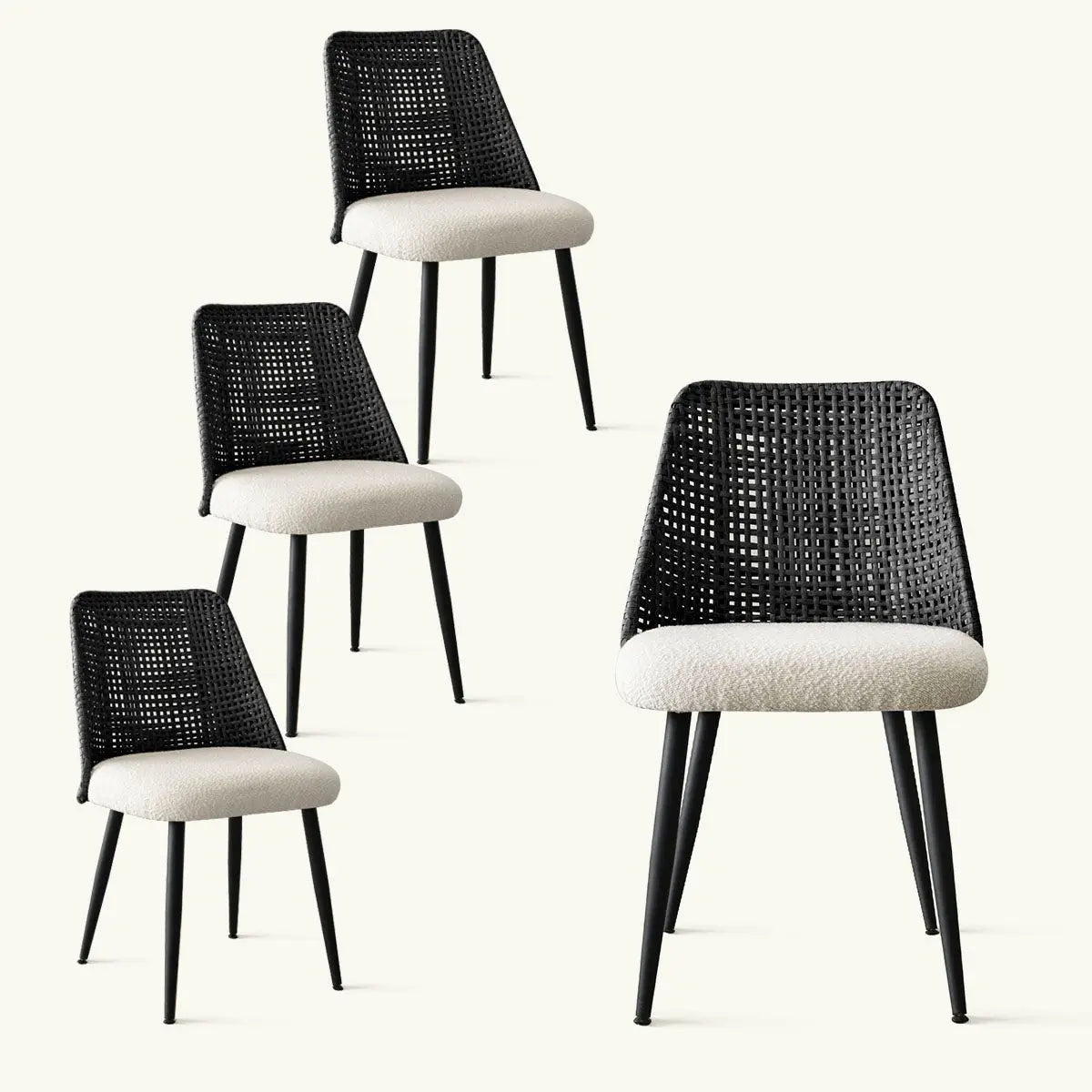 Set of four Nice Rattan Upholstered Dining Chairs with black legs and cream cushions.