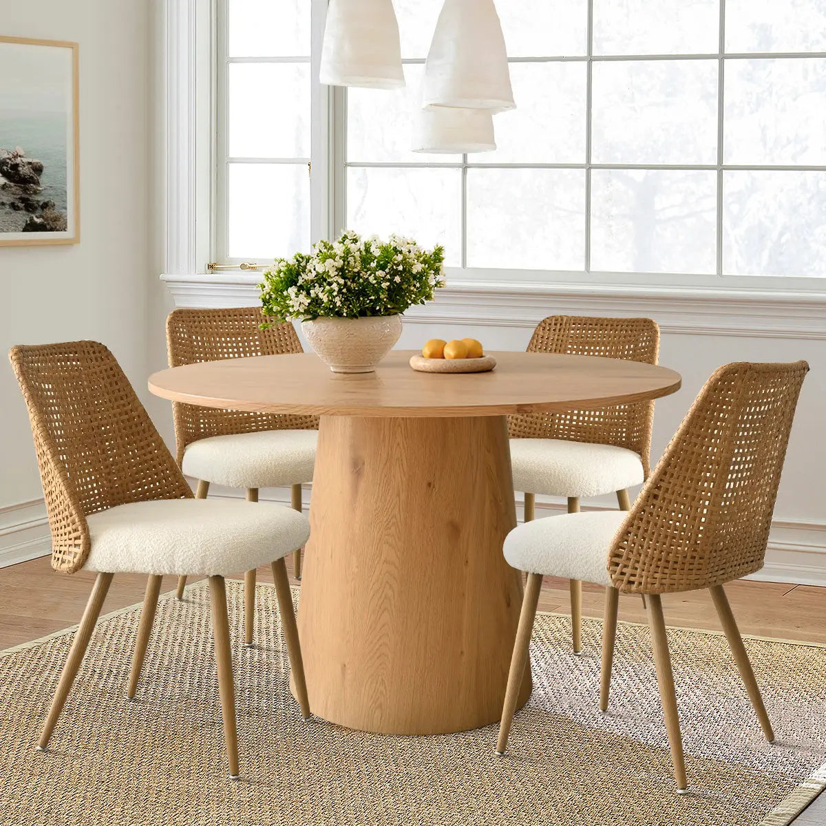 Dwen & Nice dining set with rattan chairs, beige table, white walls, wooden floor in dining room.